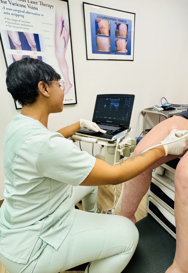 Interior photo of the Valdosta, GA Center for Vein Restoration showing the nurse working with a patient