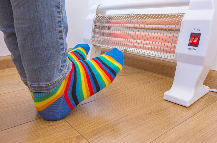 A person wearing rainbow-colored socks
