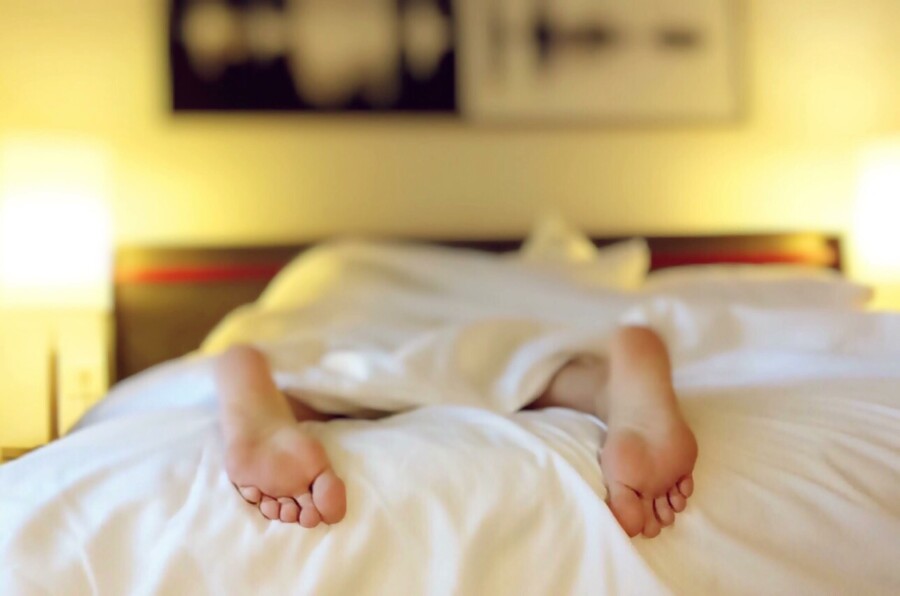 healthy feet at hotel bed sleeping